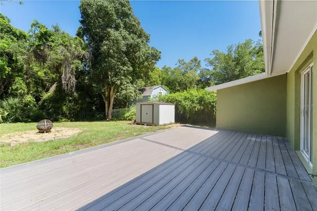 a view of a backyard of the house