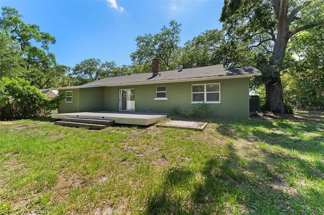 a backyard of a house with lots of green space