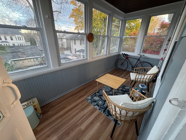 a view of a chairs and table in the balcony