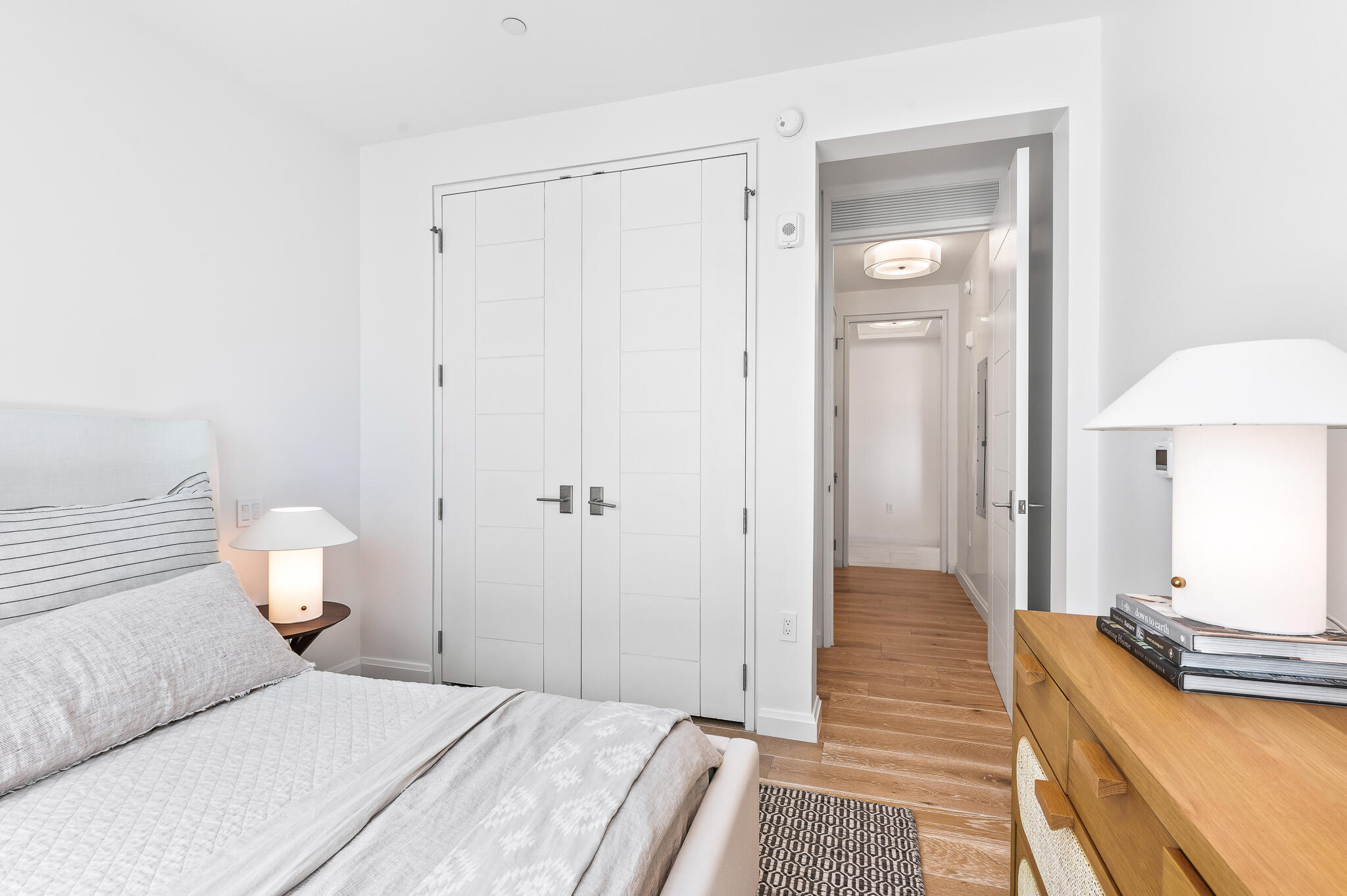 74 Governors Ct Inlet Beach, Unit W301 Inlet Beach, FL 32461 - Photo 25 of 70 a bedroom with a bed and a chandelier