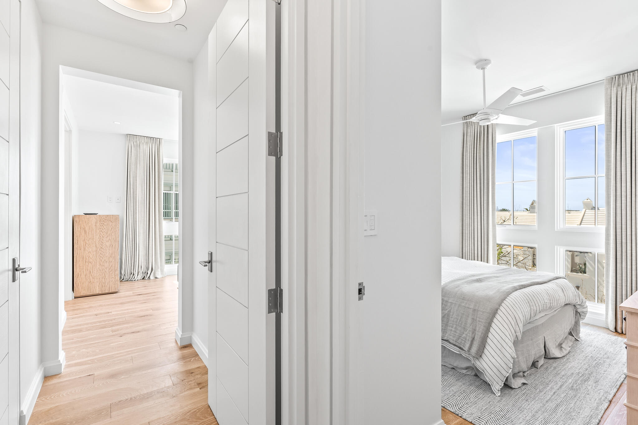 74 Governors Ct Inlet Beach, Unit W301 Inlet Beach, FL 32461 - Photo 8 of 70 a bedroom with a bed and a chandelier