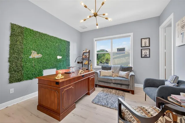 an aerial view of a house with a lake view