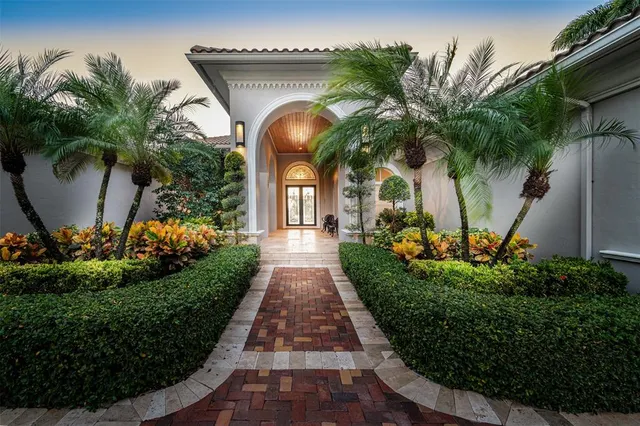 an aerial view of a residential houses with outdoor space and street view