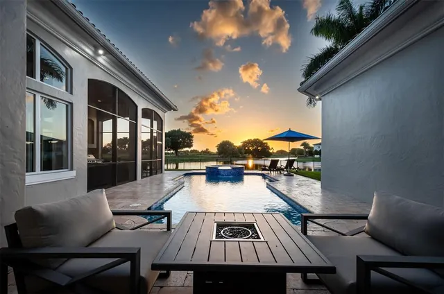 a view of a house with backyard and a garden