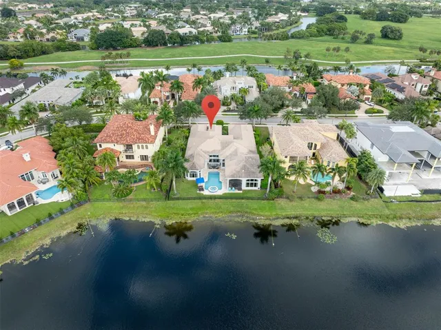 a living room with stainless steel appliances kitchen island granite countertop furniture and a view of living room