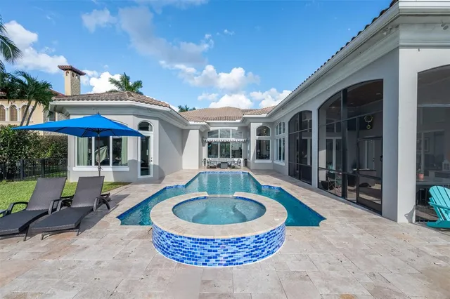 a kitchen with granite countertop a sink and cabinets