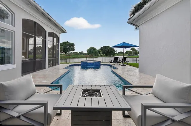 a kitchen with granite countertop stainless steel appliances and wooden cabinets