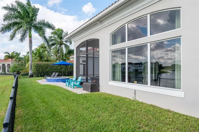 a bedroom with a bed and a flat tv screen on the dresser