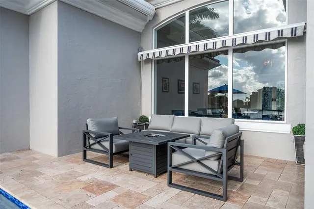 a spacious bathroom with a tub a sink and a mirror