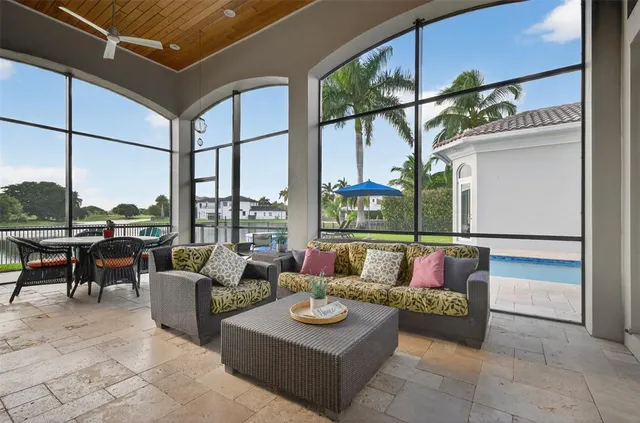 a bathroom with a granite countertop sink a toilet and bathtub