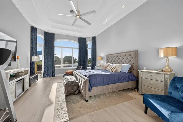 a view of a house with backyard porch and sitting area