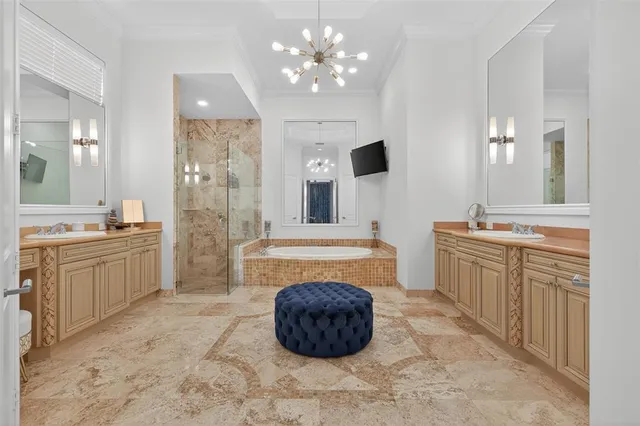 a view of a lake with a table and chairs under an umbrella