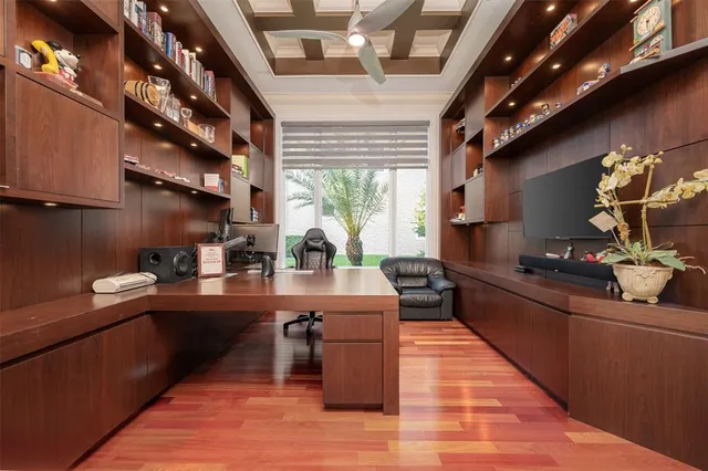 a aerial view of a house with a yard and potted plants