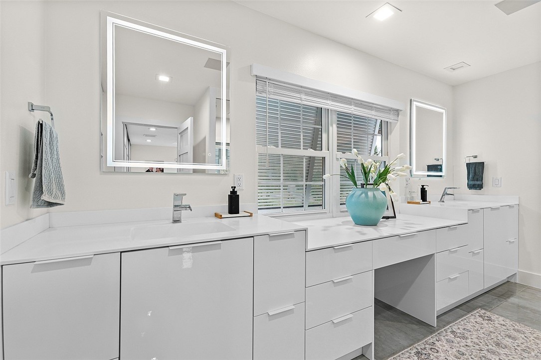 774 Azalea Lane Vero Beach, FL 32963 - Photo 15 of 34 a bathroom with a sink and a mirror