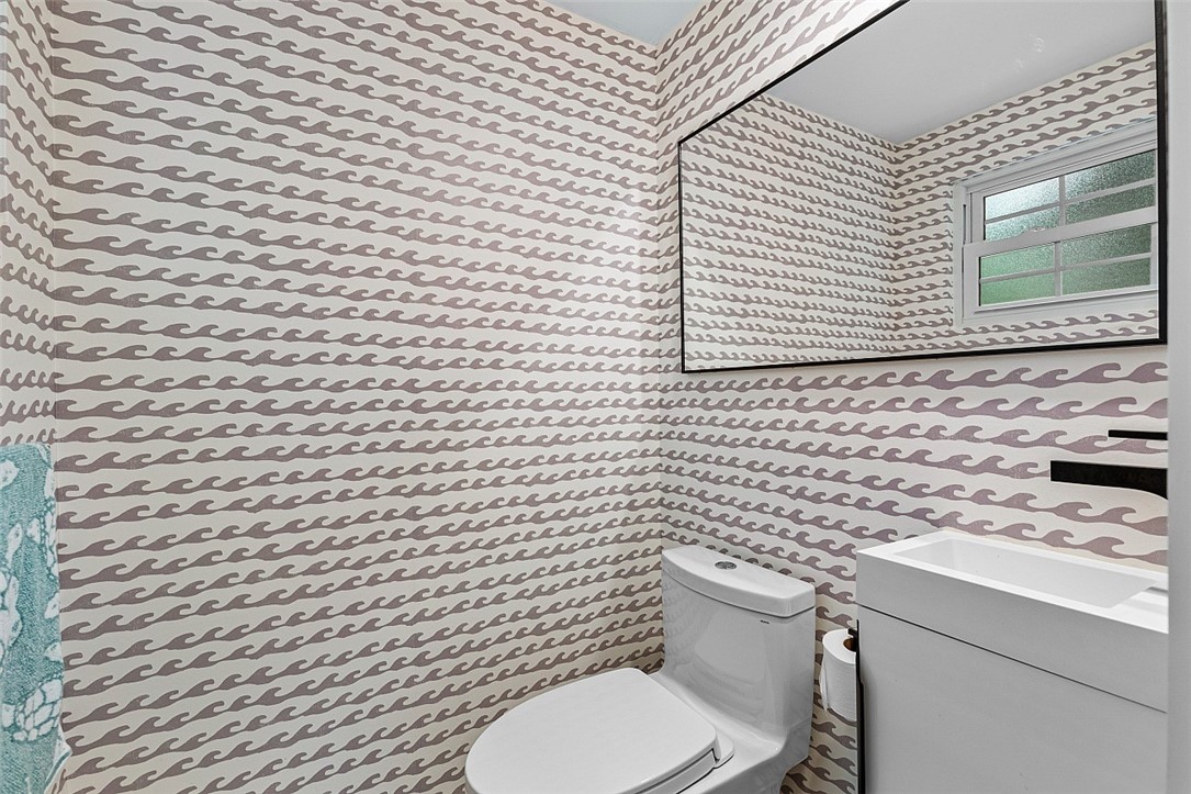 774 Azalea Lane Vero Beach, FL 32963 - Photo 17 of 34 a bathroom with a toilet and a sink