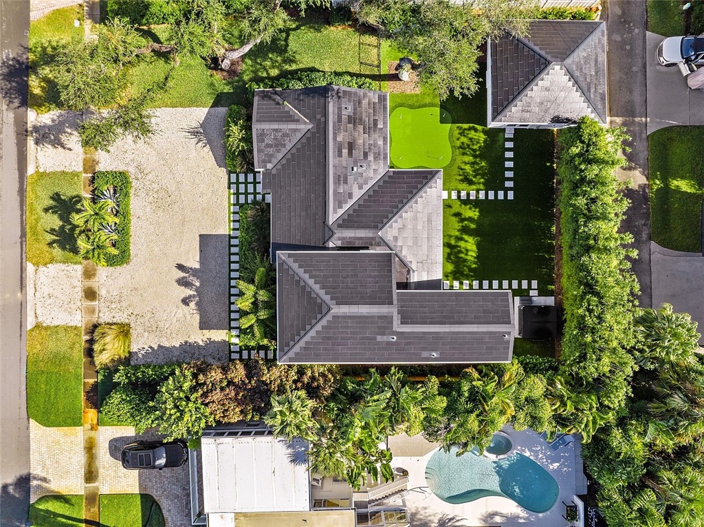 774 Azalea Lane Vero Beach, FL 32963 - Photo 2 of 34 an aerial view of a house with a yard and garden