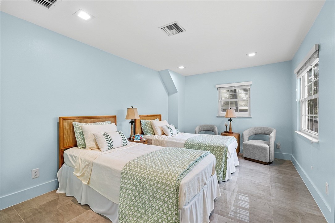 774 Azalea Lane Vero Beach, FL 32963 - Photo 21 of 34 a bedroom with two beds and a couch