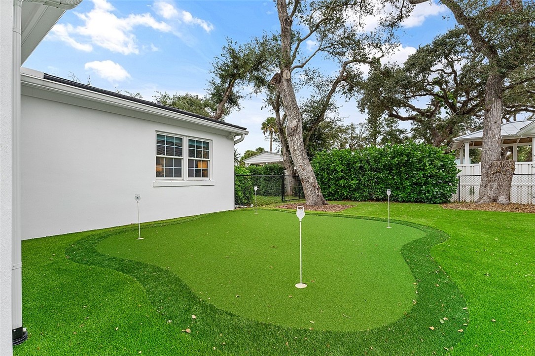 774 Azalea Lane Vero Beach, FL 32963 - Photo 28 of 34 a view of a backyard with a garden