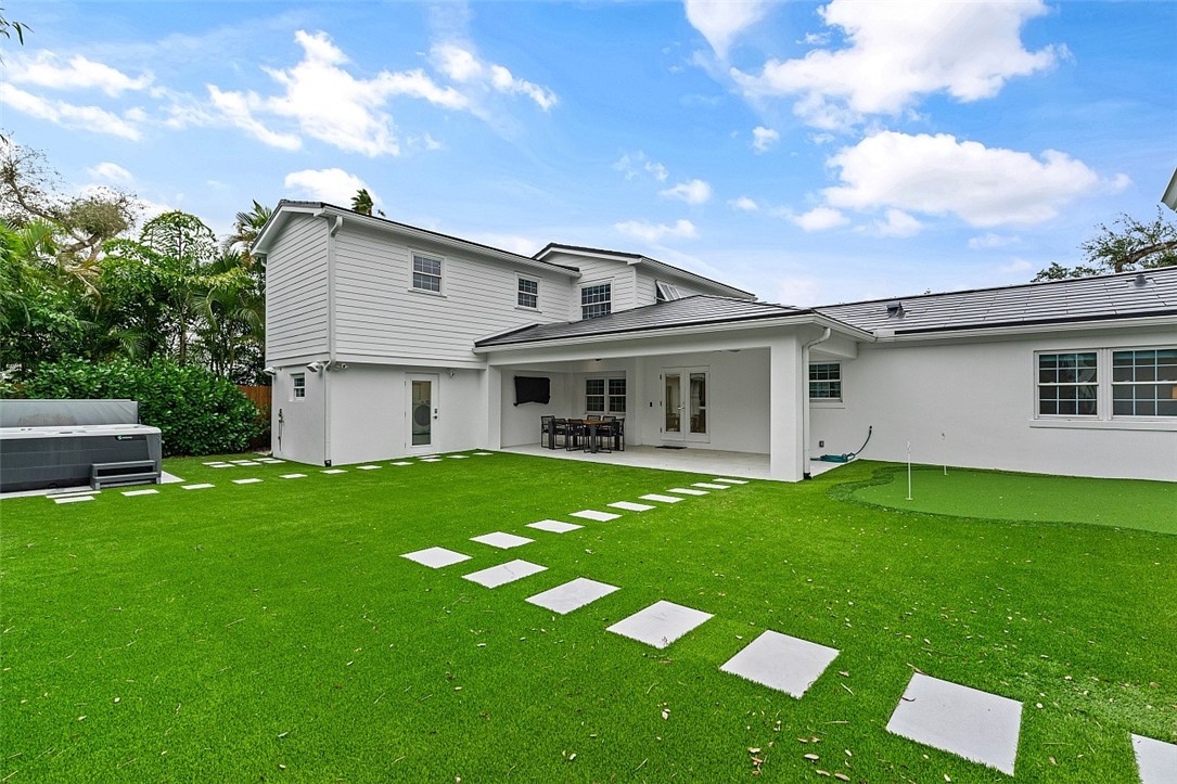 774 Azalea Lane Vero Beach, FL 32963 - Photo 31 of 34 a front view of a house with a garden
