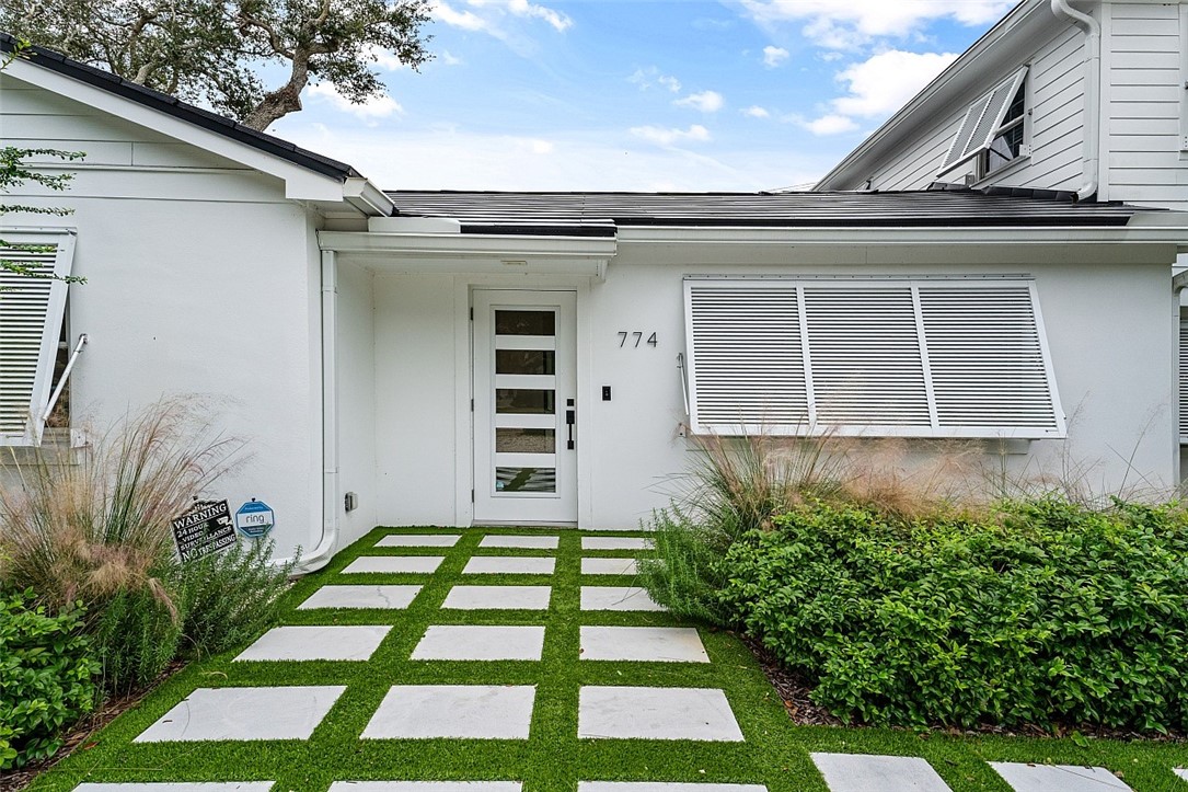 774 Azalea Lane Vero Beach, FL 32963 - Photo 5 of 34 a front view of a house with a yard