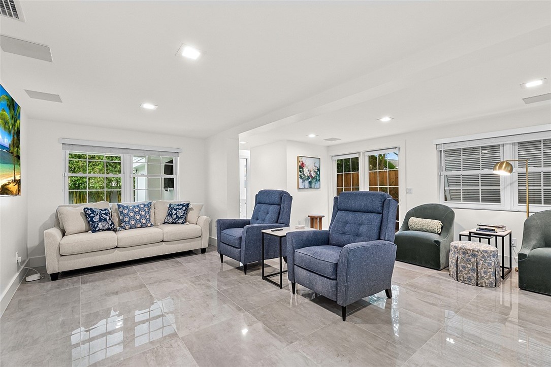 774 Azalea Lane Vero Beach, FL 32963 - Photo 6 of 34 a living room with furniture and a large window