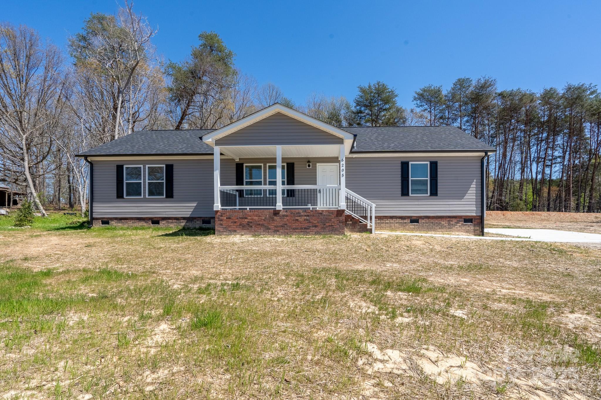 6205 Faith Road Salisbury, NC 28146 - Photo 1 of 33 front view of a house with a yard