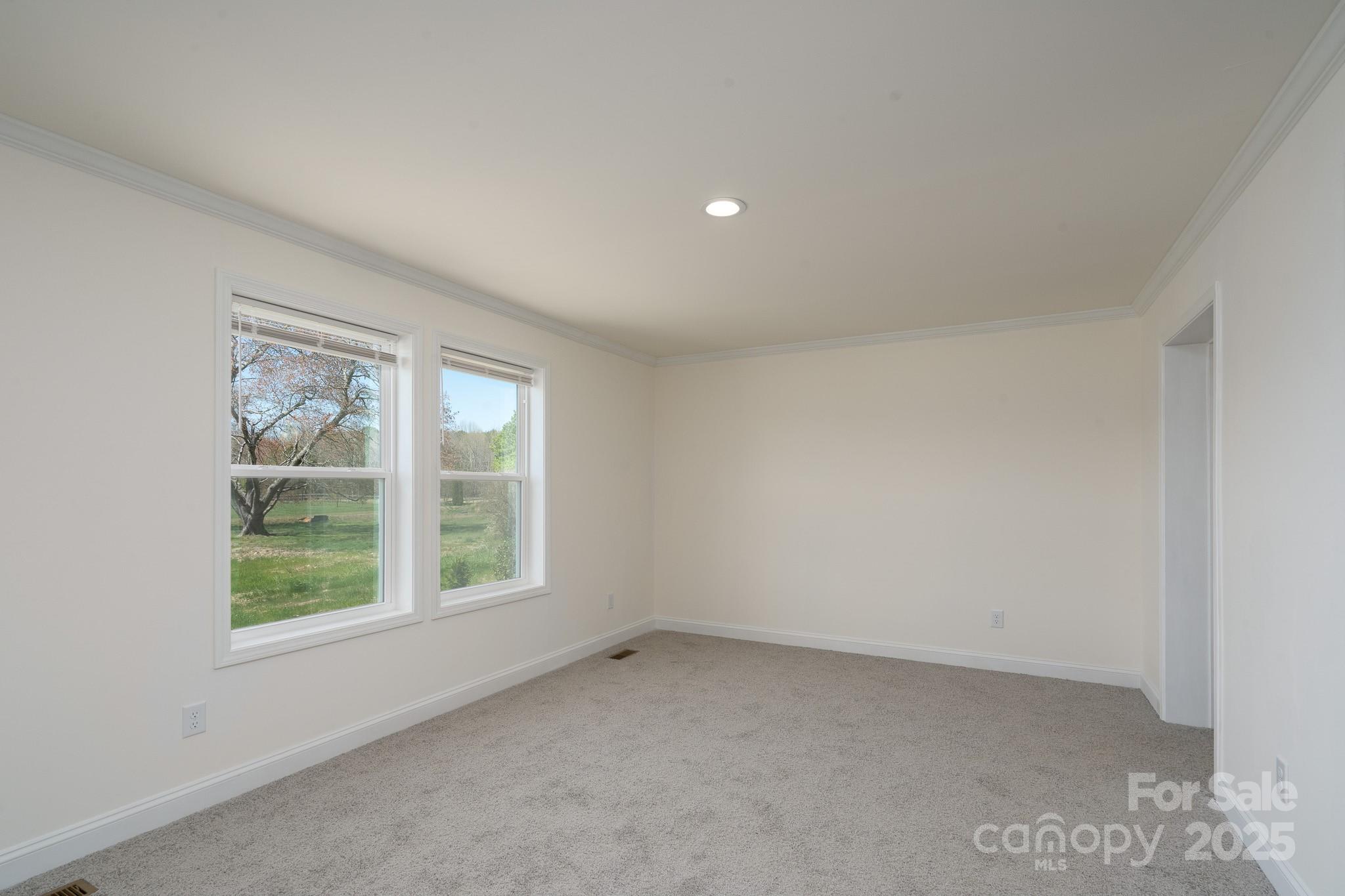 6205 Faith Road Salisbury, NC 28146 - Photo 16 of 33 an empty room with a window