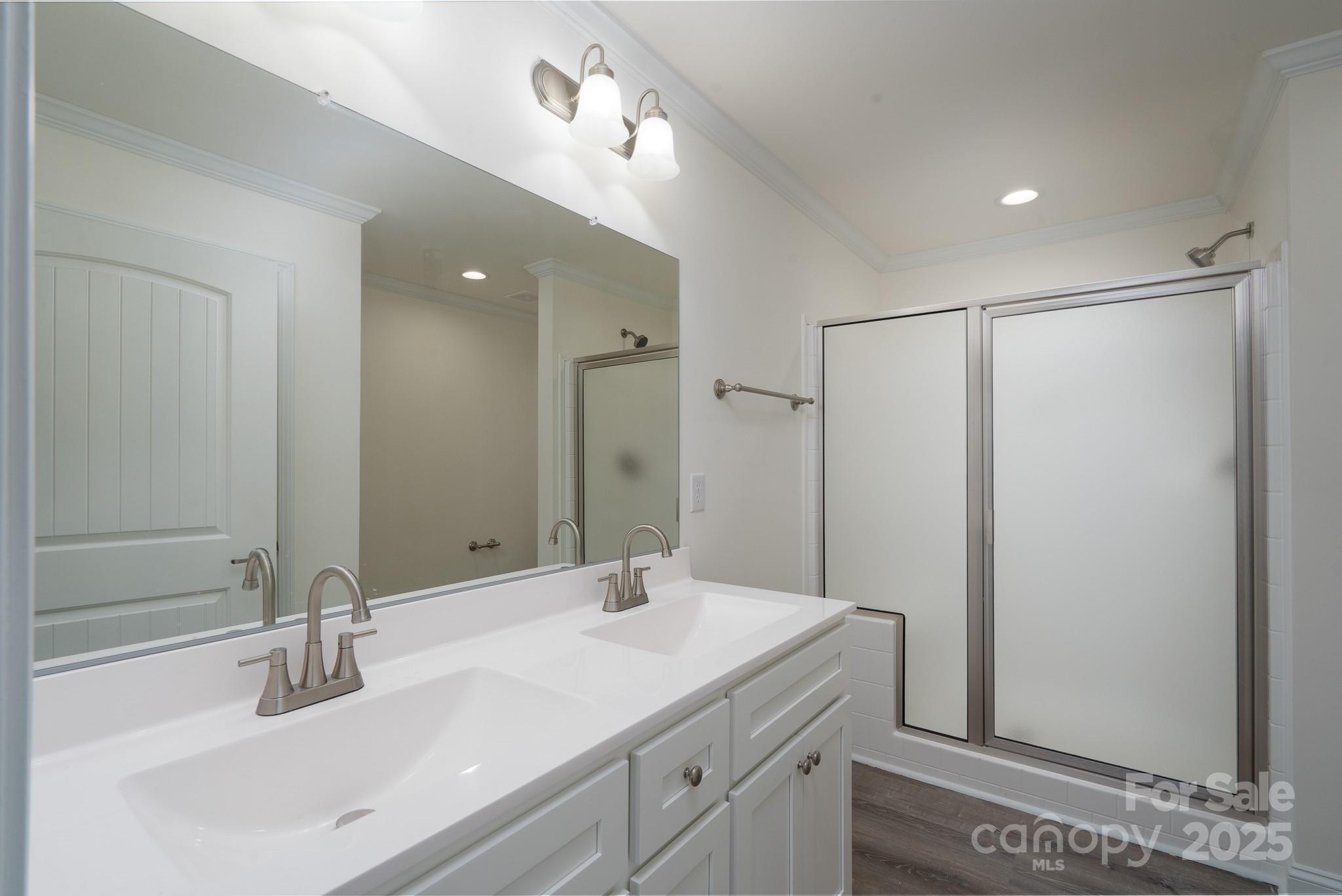6205 Faith Road Salisbury, NC 28146 - Photo 18 of 33 a bathroom with a sink and a mirror