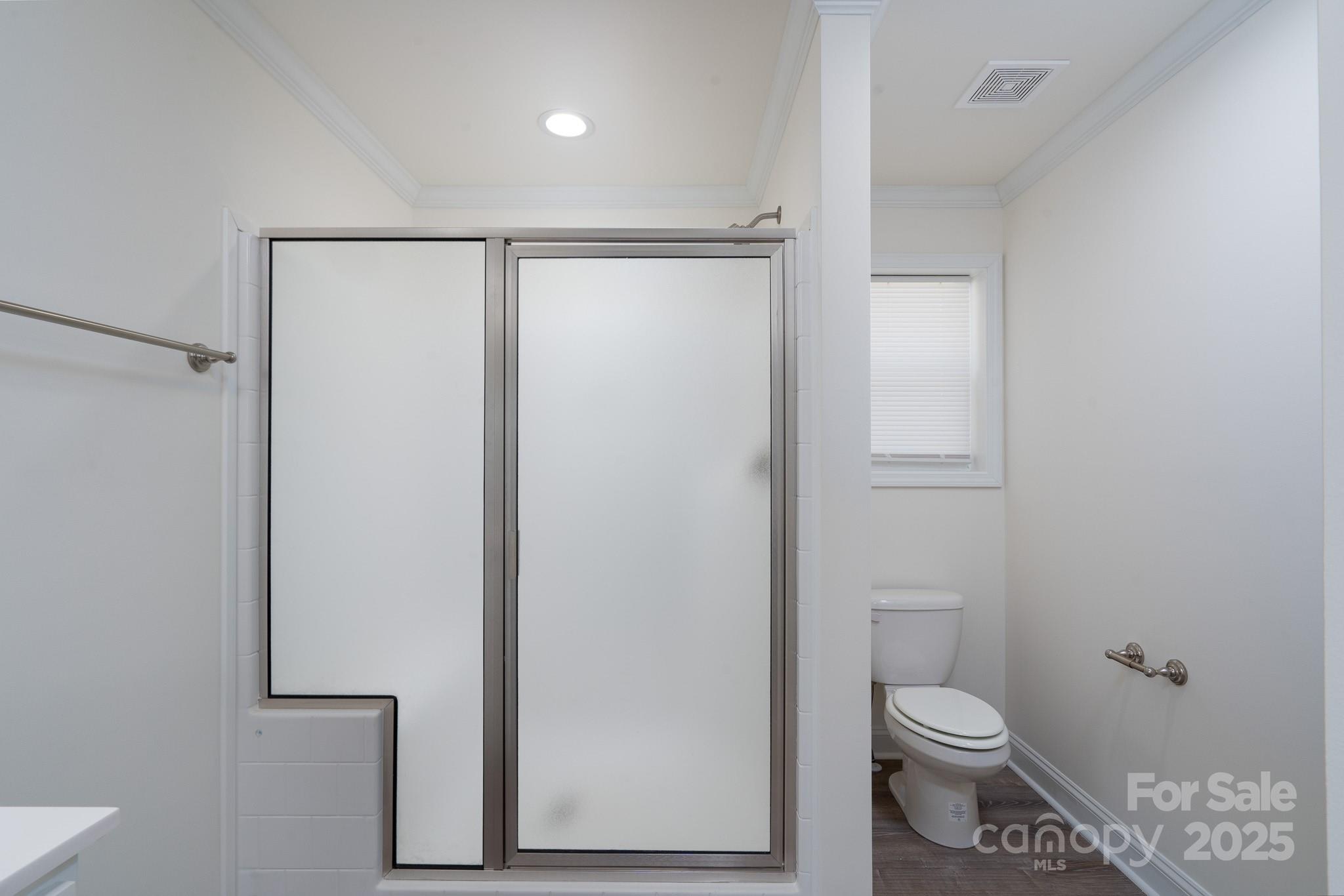 6205 Faith Road Salisbury, NC 28146 - Photo 19 of 33 a bathroom with a toilet and a shower