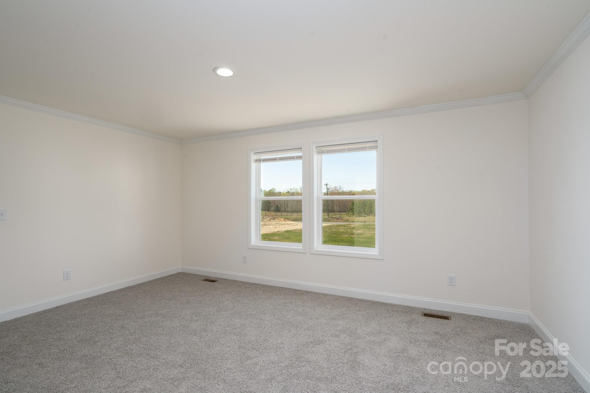 6205 Faith Road Salisbury, NC 28146 - Photo 20 of 33 an empty room with a window
