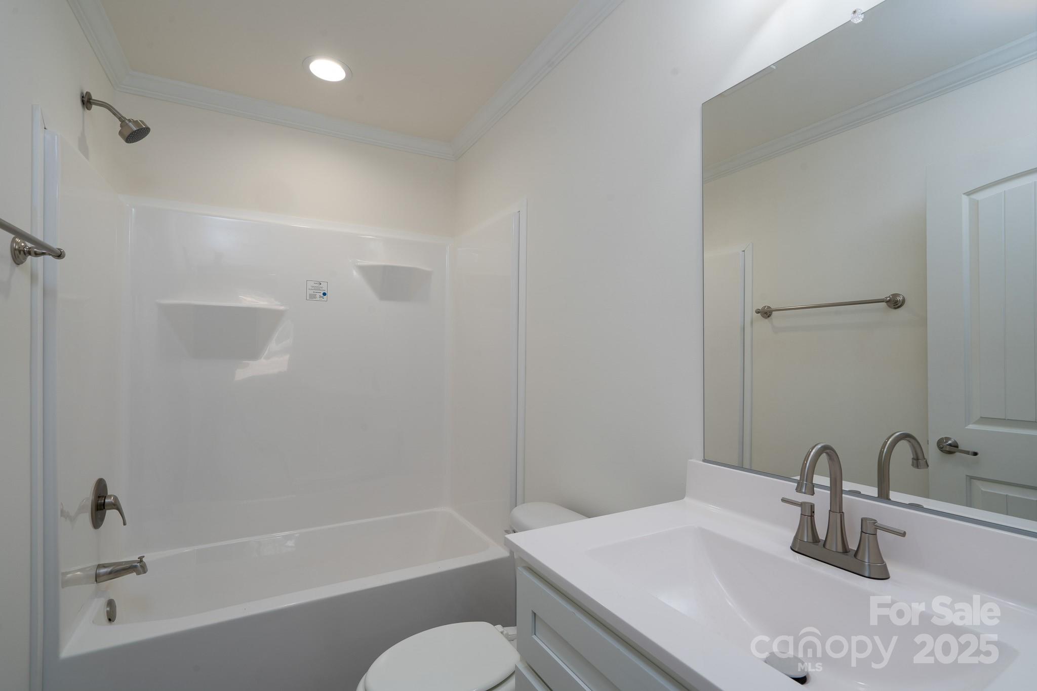 6205 Faith Road Salisbury, NC 28146 - Photo 27 of 33 a bathroom with a sink toilet and shower