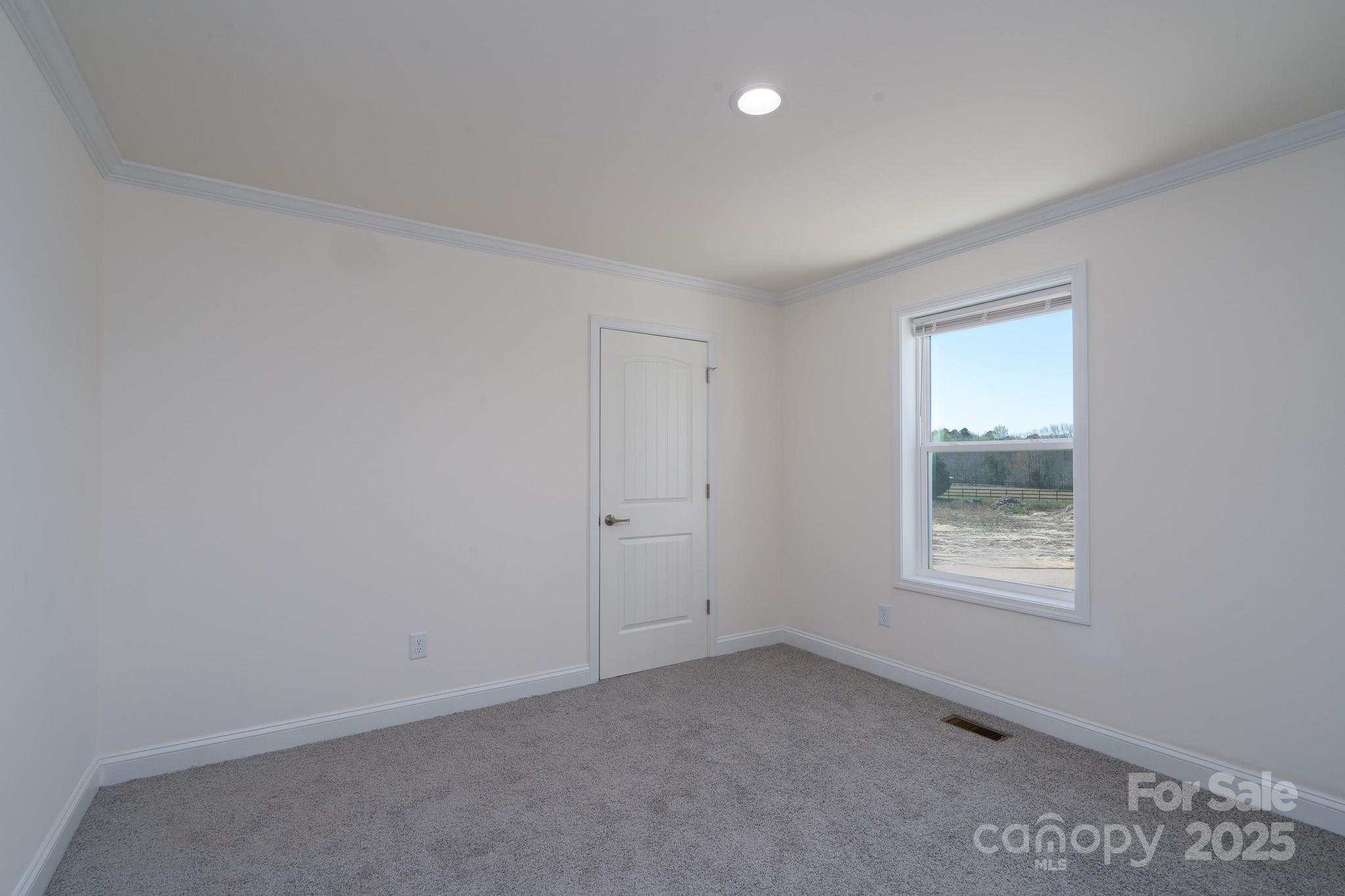 6205 Faith Road Salisbury, NC 28146 - Photo 28 of 33 an empty room with a window