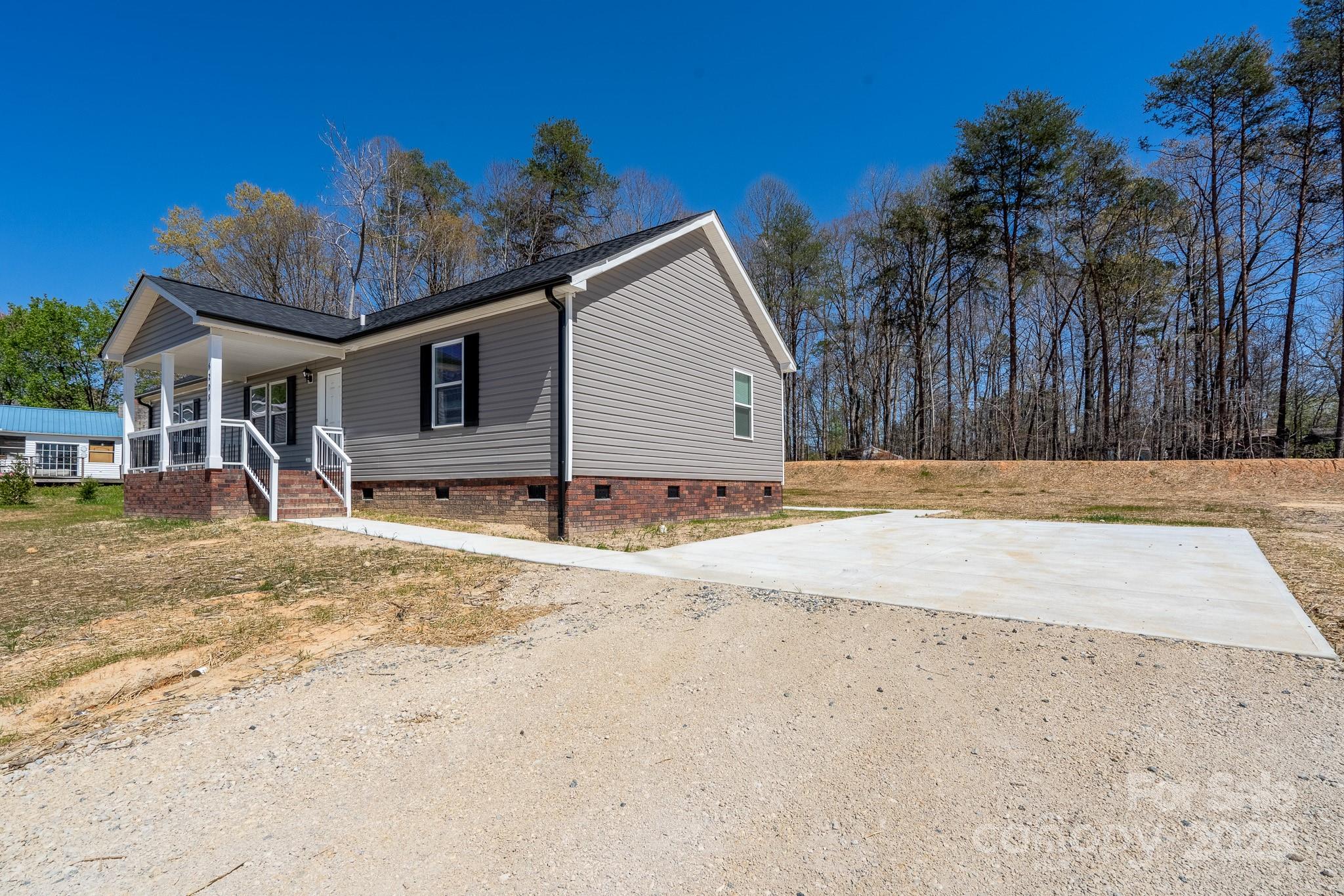 6205 Faith Road Salisbury, NC 28146 - Photo 6 of 33 a view of a house with a yard