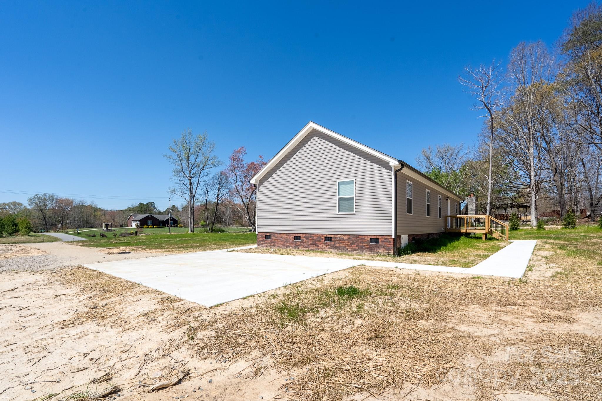 6205 Faith Road Salisbury, NC 28146 - Photo 7 of 33 a view of a house with a yard