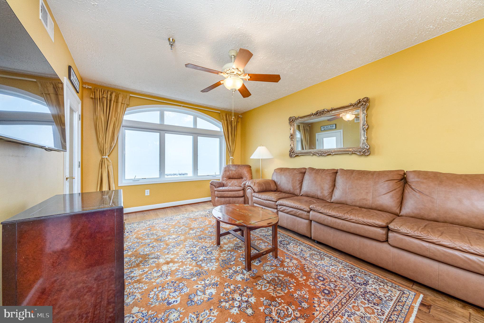 100 Taylor Street, Unit 505 Colonial Beach, VA 22443 - Photo 13 of 22 a living room with furniture and a large window