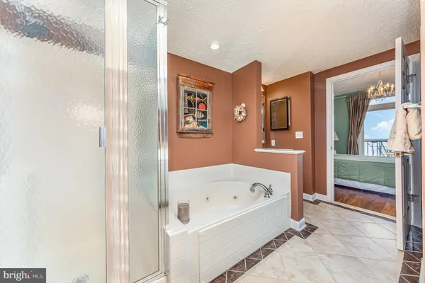 a bathroom with a bathtub and a shower