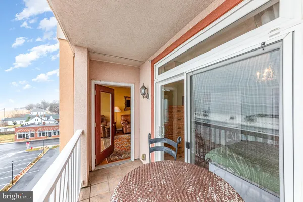 a balcony view with a glass door