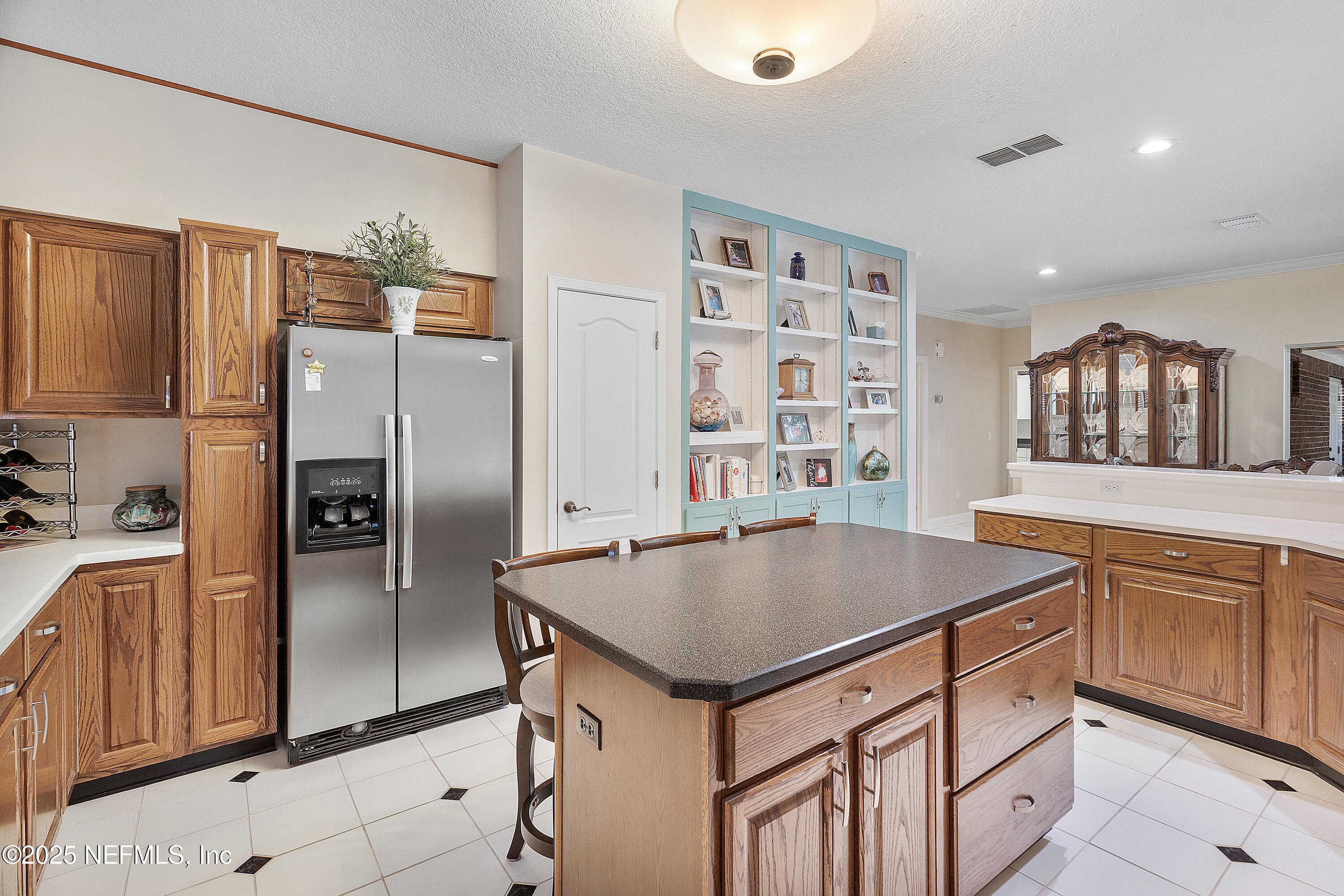 2688 Seneca Drive St. Johns, FL 32259 - Photo 15 of 62 a kitchen with granite countertop a refrigerator and a sink