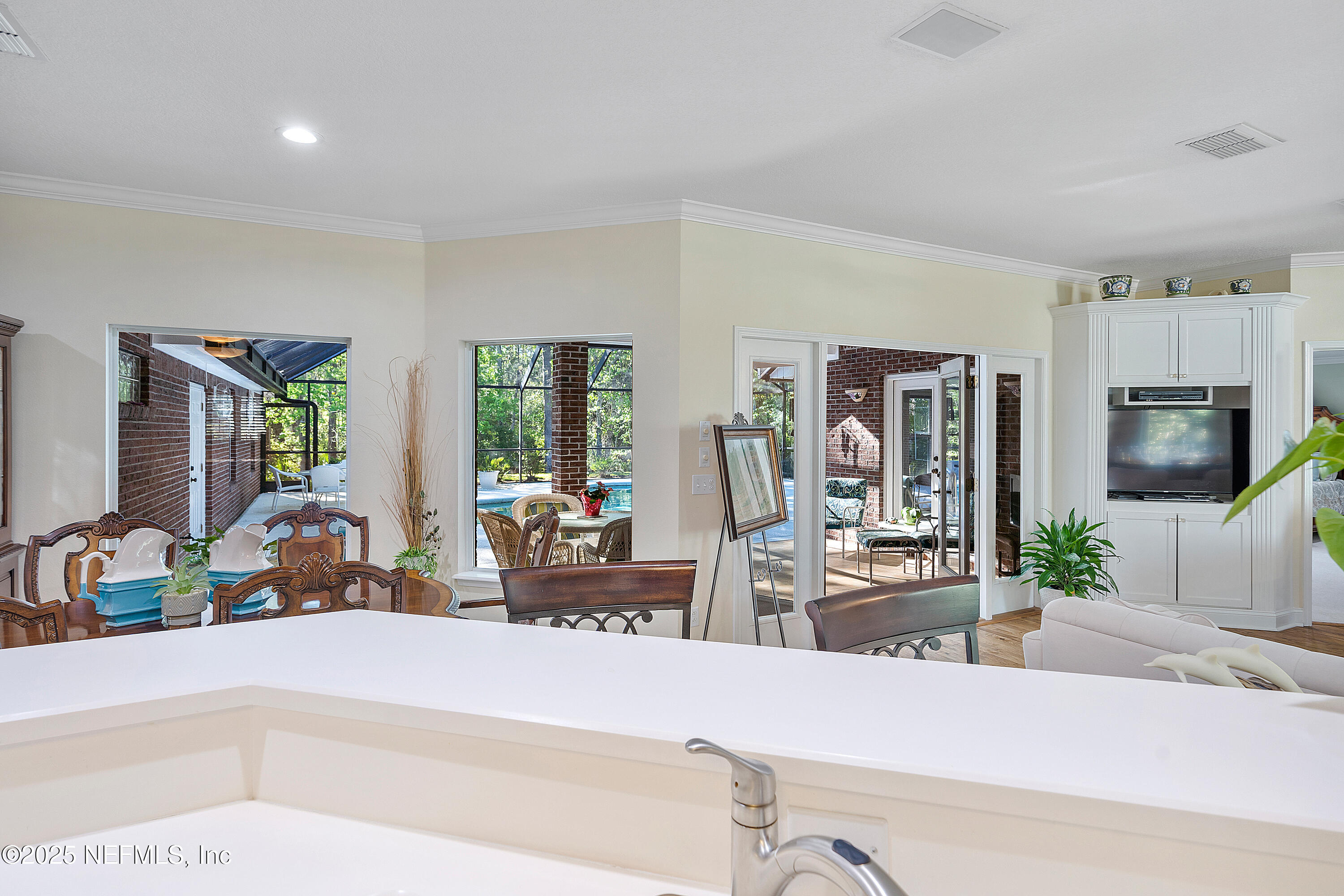 2688 Seneca Drive St. Johns, FL 32259 - Photo 18 of 62 a living room with furniture a flat screen tv and a large window