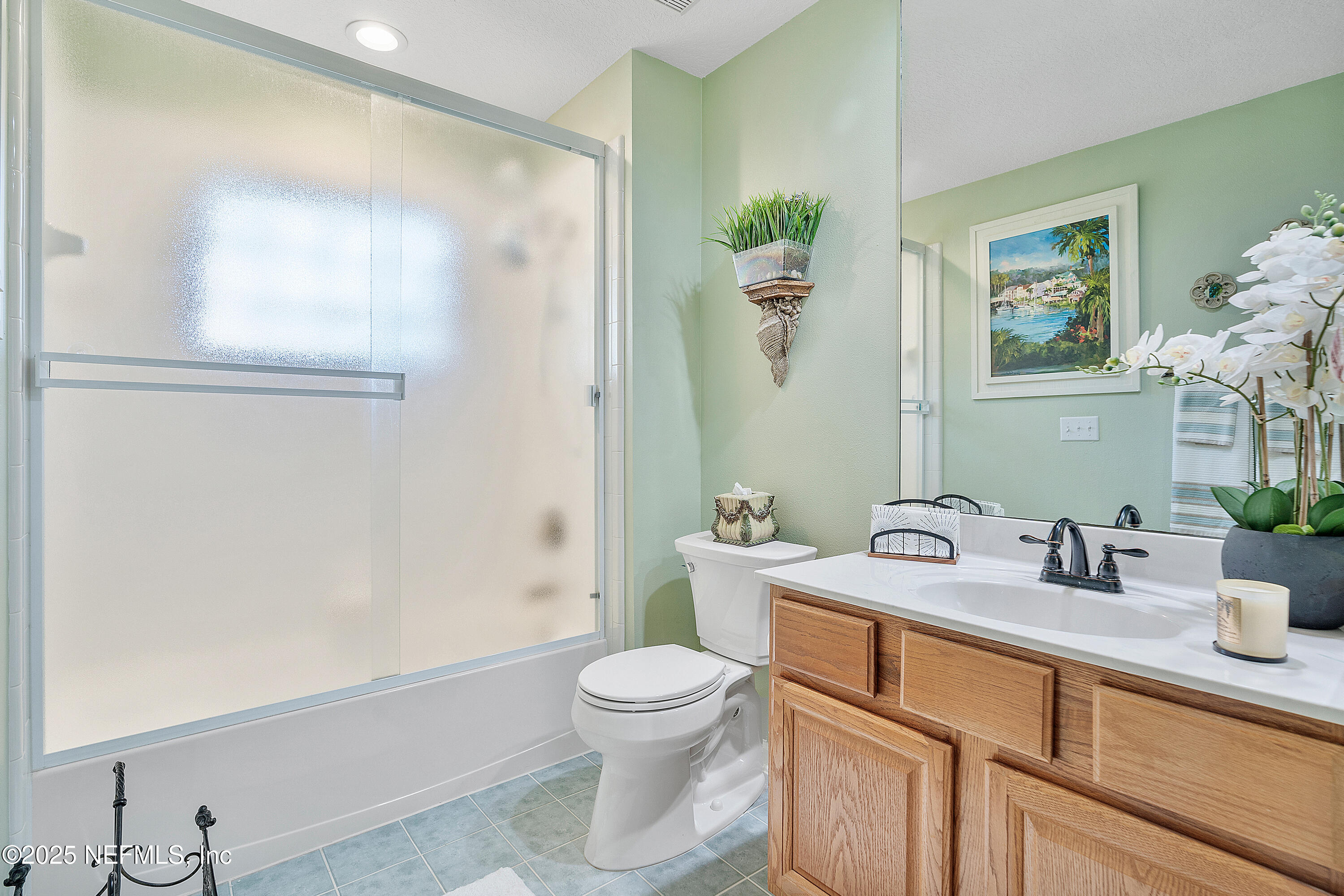 2688 Seneca Drive St. Johns, FL 32259 - Photo 29 of 62 a bathroom with a toilet sink and mirror