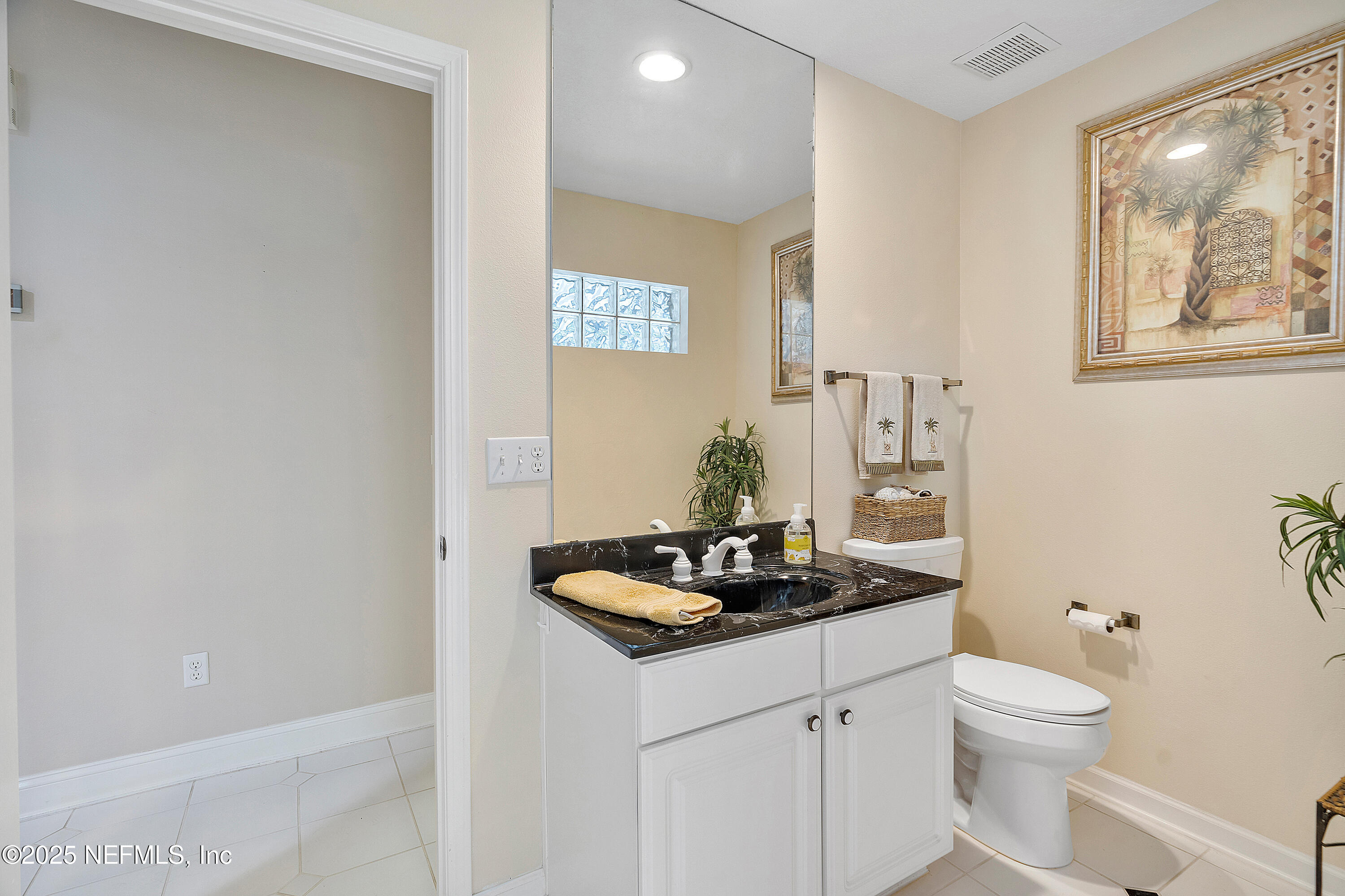 2688 Seneca Drive St. Johns, FL 32259 - Photo 32 of 62 a bathroom with a granite countertop sink and a toilet
