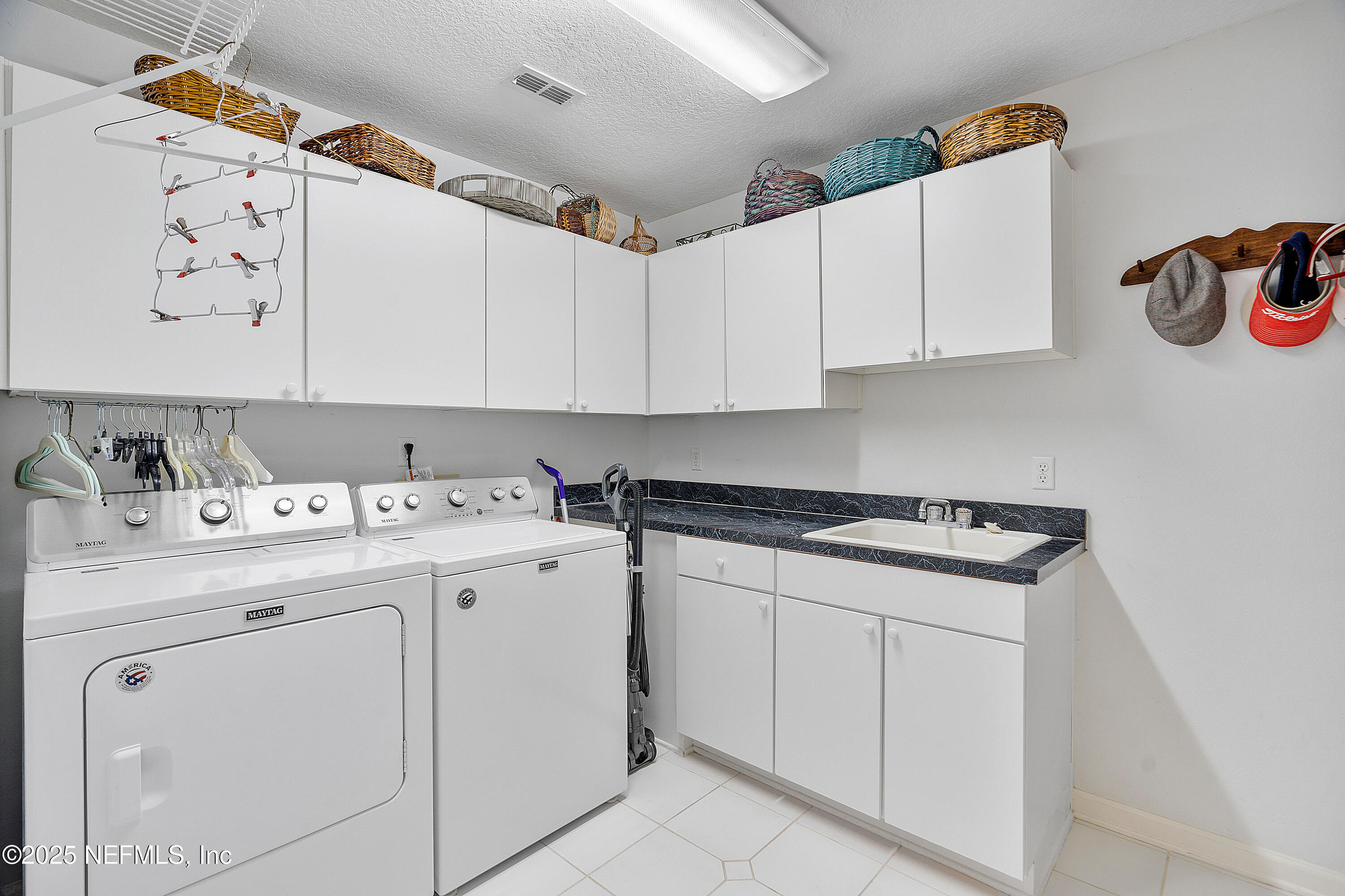 2688 Seneca Drive St. Johns, FL 32259 - Photo 34 of 62 a kitchen with cabinets appliances a sink and a stove