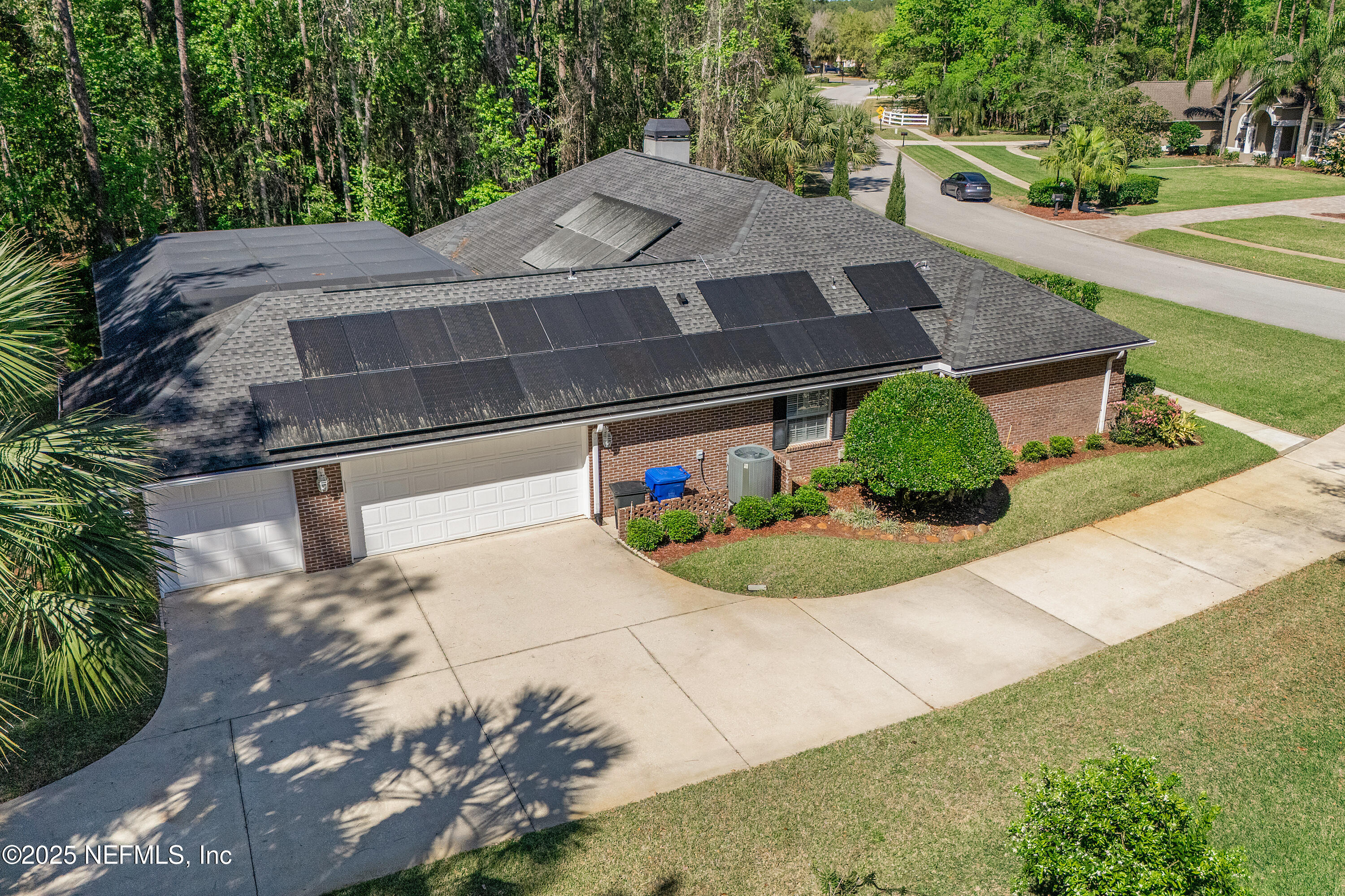2688 Seneca Drive St. Johns, FL 32259 - Photo 5 of 62 a view of a white house with a yard and large tree