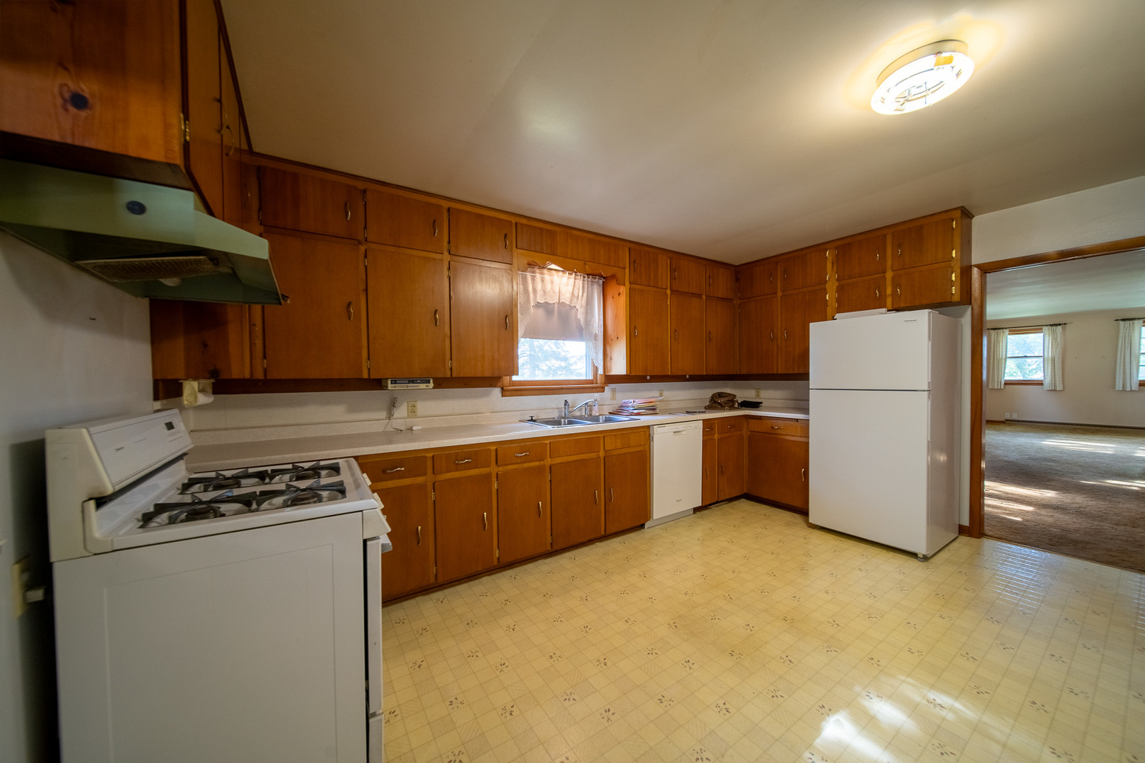 2056 Peek Home Road Dixon, IL 61021 - Photo 3 of 47 a kitchen with a white cabinets stove and refrigerator