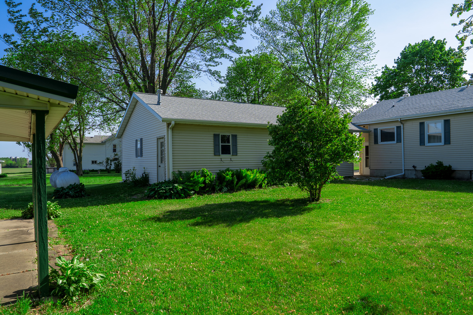 2056 Peek Home Road Dixon, IL 61021 - Photo 33 of 47 a view of a house with a yard plants and large tree