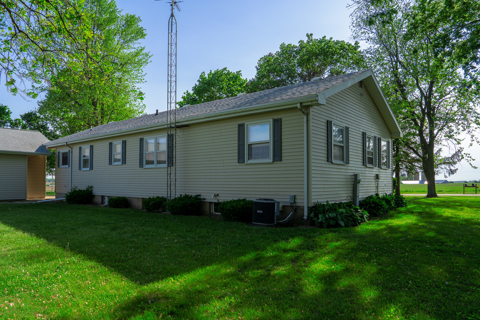 2056 Peek Home Road Dixon, IL 61021 - Photo 35 of 47 a view of a backyard with plants and large tree