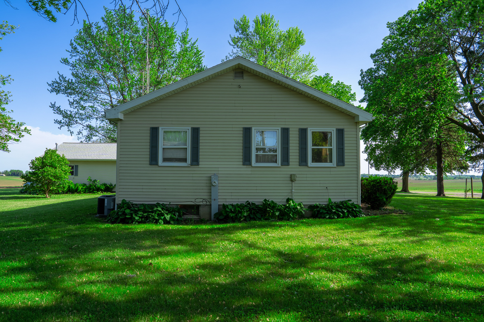 2056 Peek Home Road Dixon, IL 61021 - Photo 36 of 47 a view of a backyard with potted plants and large trees