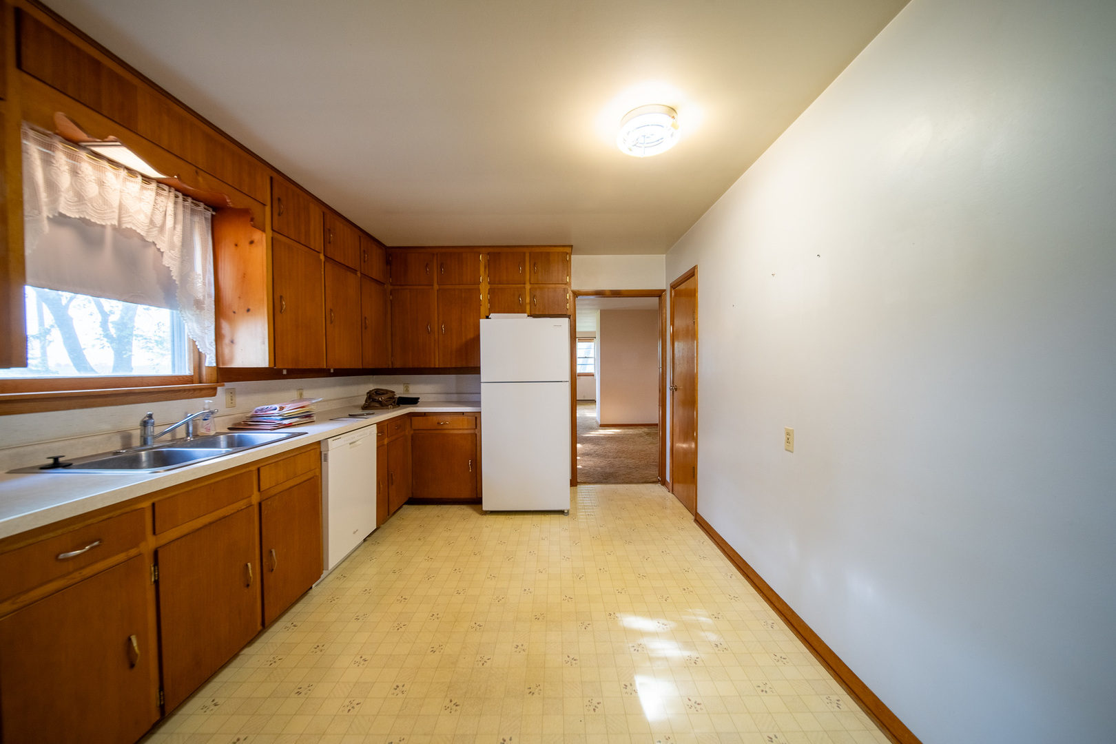 2056 Peek Home Road Dixon, IL 61021 - Photo 4 of 47 a kitchen with sink a refrigerator and cabinets