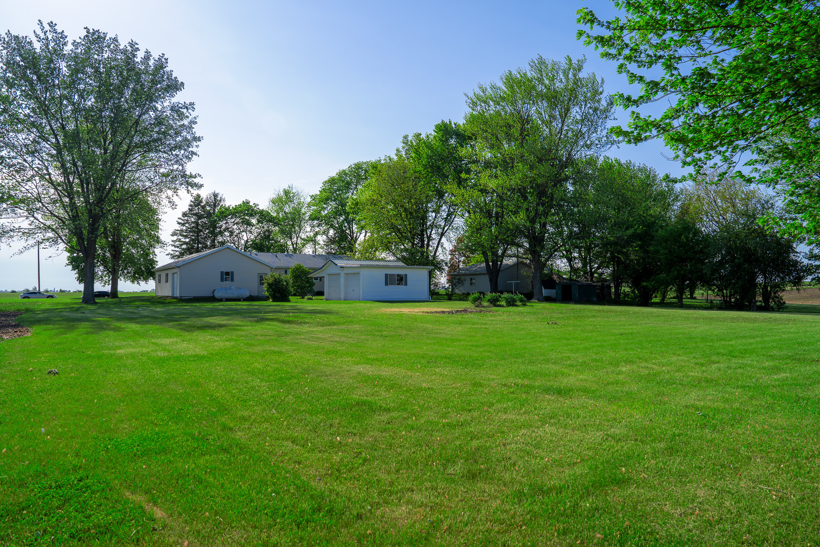 2056 Peek Home Road Dixon, IL 61021 - Photo 42 of 47 a front view of house with garden and trees