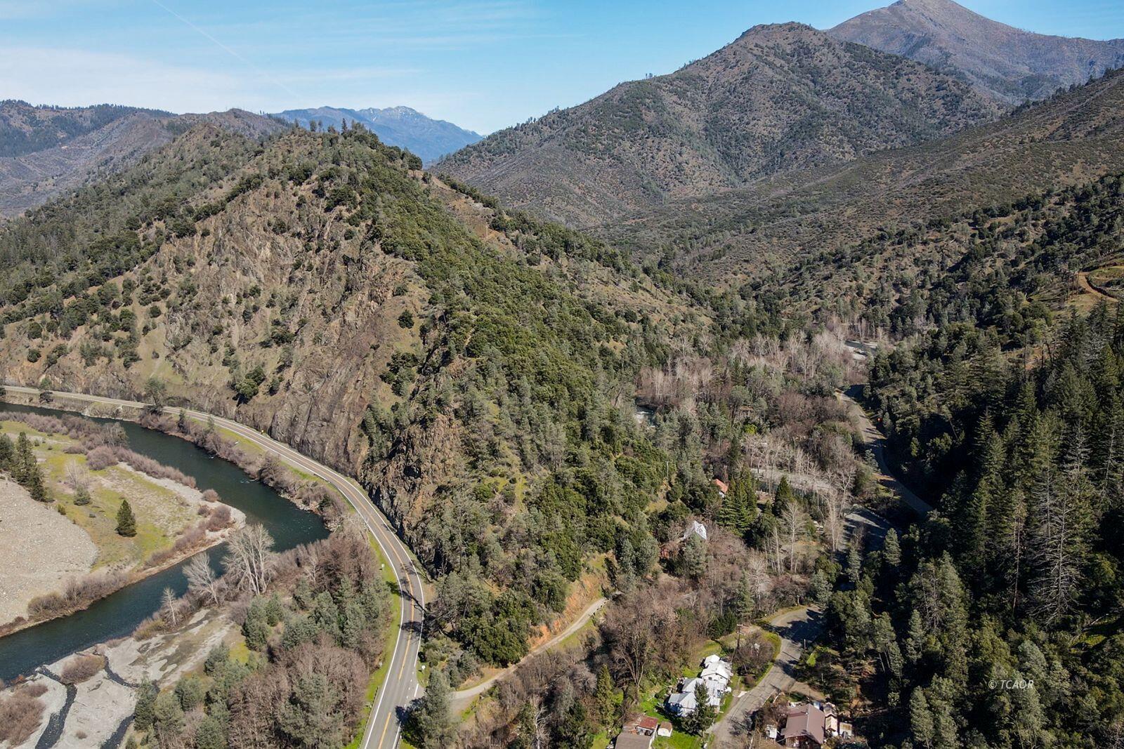 71 Gilzean Road Junction City, CA 96048 - Photo 2 of 14 a view of a dry yard with wooden fence